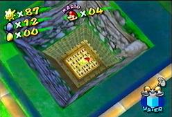 Holding a banana, in one of those holes in Pianta Village